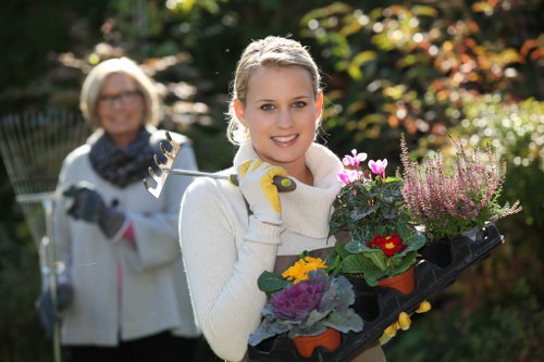 Insured gardening service in Brentford preparing equipment safely